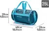 A teal and blue duffel bag with a leaf pattern, shown with dimensions indicated. Produktbild-Vorschau