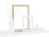 A white shelf displaying decorative items. Produktbild-Vorschau