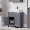 A bathroom vanity with a sink and faucet. Produktbild-Vorschau