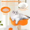 A fluffy cat is resting on a multi-tiered cat tree with flower-shaped platforms. Podgląd zdjęcia produktu