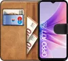 A book-style phone case with a phone inside, showing cards and cash. Produktbild-Vorschau