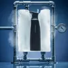 A black thermos bottle is encased in ice, surrounded by pipes and a pressure gauge, with steam rising. Produktbild-Vorschau