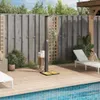 An outdoor shower next to a swimming pool on a wooden deck. Voir les images du produit
