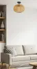 A living room scene with a sofa, bookshelf, and a ceiling lamp. Náhled obrázku produktu