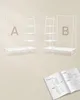 Two identical white shelving units with a clothes rack above, labeled A and B, with an open instruction manual below. Náhled obrázku produktu