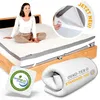 A woman sitting on a mattress topper on a bed, with a rolled-up topper and certification logos shown. Produktbild-Vorschau