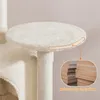 Close-up of a beige cat tree platform with an inset showing the layered construction of the particleboard. Podgląd zdjęcia produktu