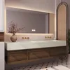 A modern bathroom vanity with a double sink, LED mirror, and wooden cabinets. Anteprima dell’immagine prodotto