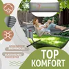 A woman and two children relaxing in a hammock outdoors. Produktbild-Vorschau