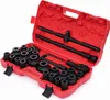 A red plastic toolbox containing a set of black metal sockets and wrenches. Produktbild-Vorschau