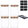 Four clear glass jars with bamboo lids and a set of chalkboard stickers with chalk. Produktbild-Vorschau