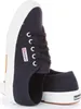 A pair of navy blue Superga sneakers with white soles and laces, shown from a side angle. Produktbild-Vorschau