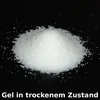 A pile of white granular material on a black surface. Produktbild-Vorschau