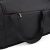 A close-up view of a black duffel bag, showing a zipper and a handle. Náhľad obrázku produktu