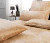 A close-up view of a bed with pillows and bedding. Produktbild-Vorschau
