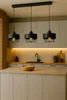 A modern kitchen with a counter, sink, and pendant lights. Náhled obrázku produktu