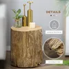 A close-up shot of a faux wood stump side table with decorative items on top. Produktbild-Vorschau