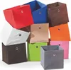 A collection of fabric storage boxes in various colors, stacked and arranged. Podgląd zdjęcia produktu