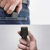 A collage showing a charger being put into a pocket and a charger being held in a hand. Produktbild-Vorschau
