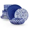 A stack of blue and white patterned plates and bowls. Produktbild-Vorschau