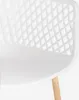 A close-up view of a white chair with a diamond-patterned backrest and a wooden leg. Produktbild-Vorschau
