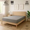 A bed with a grey fitted sheet in a bedroom setting. Produktbild-Vorschau