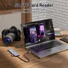 A laptop, camera, and card reader are set up on a wooden desk, suggesting a workflow for photographers or videographers. Produktbild-Vorschau