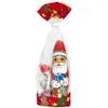 A Christmas-themed chocolate gift bag featuring a chocolate Santa figure and smaller chocolates. Náhled obrázku produktu