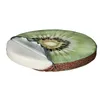 A cross-section of a round cushion designed to look like a kiwi fruit, showing its internal layers. Produktbild-Vorschau