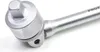 Close-up of a silver ratchet wrench head with a hexagonal socket. Anteprima dell’immagine prodotto