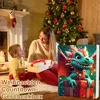 A mother and child are sitting in front of a Christmas tree, with the child holding a gift. Produktbild-Vorschau