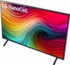 A television set with a colorful abstract display and two black legs. Náhled obrázku produktu
