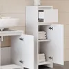A white bathroom cabinet with open doors and shelves displaying folded towels, next to a white sink. Anteprima dell’immagine prodotto