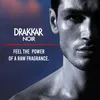 A close-up marketing image of a man's face and shoulder, with text overlay advertising Drakkar Noir fragrance. Náhled obrázku produktu