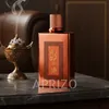 A perfume bottle and an incense burner are displayed on a marble table, with a leather chair in the background. Anteprima dell’immagine prodotto
