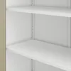 A close-up view of the interior of a white metal cabinet with multiple shelves. Voir les images du produit