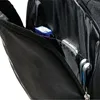 Close-up view of the interior pockets of a black rucksack, showing a blue item, a silver smartphone, and a pair of earbuds. Produktbild-Vorschau