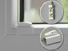 Close-up views of white plastic mounting plates and a green cord for window blinds. Produktbild-Vorschau