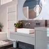 A modern bathroom with a sink, faucet, mirror, and towel warmer. Produktbild-Vorschau