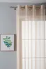 A sheer curtain hangs in front of a window, with a framed picture of a green plant on the wall to the left. Produktbild-Vorschau