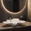A modern bathroom sink with a unique, artistic design. Produktbild-Vorschau