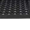 A close-up, angled view of a black rubber mat with a hexagonal hole pattern. Podgląd zdjęcia produktu