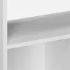 A close-up view of a white shelf in a bookshelf. Produktbild-Vorschau