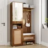 A hallway furniture set with a tall cabinet, mirror, hooks, and a bench, placed next to a door and a window. Produktbild-Vorschau