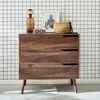 A wooden dresser with three drawers against a black and white grid wallpaper. Produktbild-Vorschau
