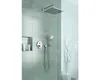 A modern shower fixture with a square rain showerhead and a handheld shower wand, mounted on a tiled wall. Produktbild-Vorschau