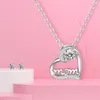 A jewelry set consisting of a necklace and earrings displayed on a pink background with white pedestals. Náhľad obrázku produktu