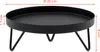 A black round plant stand with three legs, shown from a side angle with dimensions indicated. Voir les images du produit