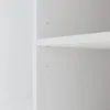 A close-up view of a white shelf and its mounting hardware inside a cabinet. Produktbild-Vorschau