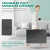 A man is carrying a folded mattress in a living room setting. Produktbild-Vorschau